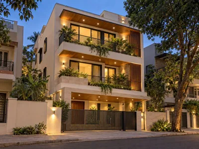 Illustrative render of a three-storey independent house at dusk