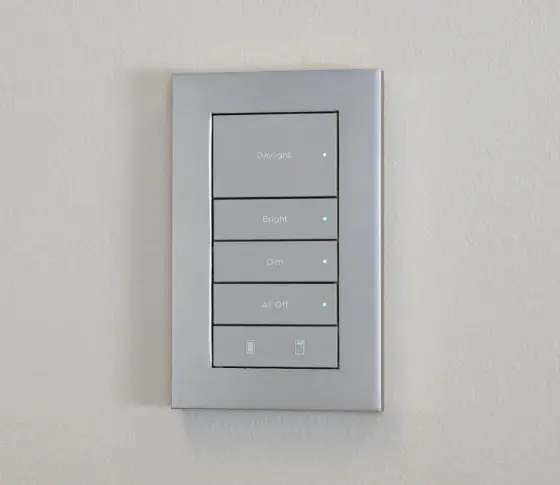 Control4 Lux wired keypad: white multi-button face in a silver-tone metal plate