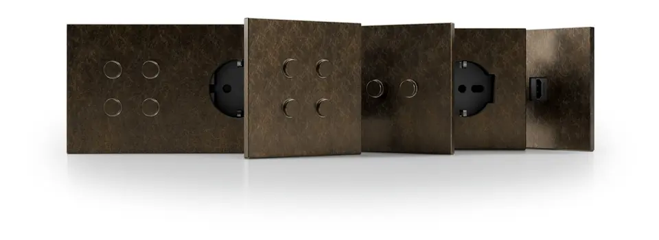 Ekinex Proxima family in a dark textured metal finish: push-button plates, a socket and a frame side by side