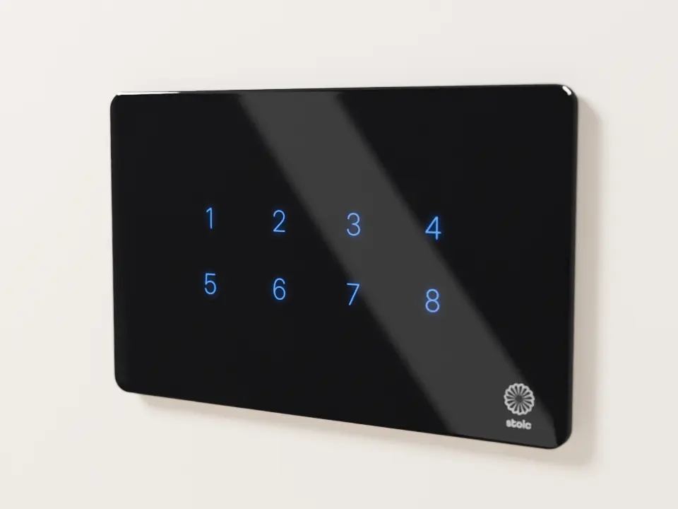Stoic black glass touch panel with lit blue icons, on a cream wall
